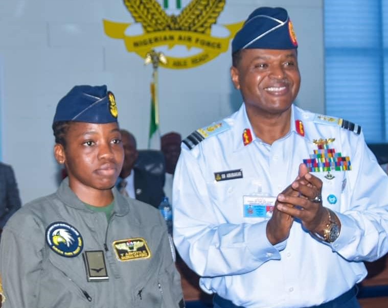 Flying Officer Tolulope Arotile with Air Marshal Sadique Abubakar